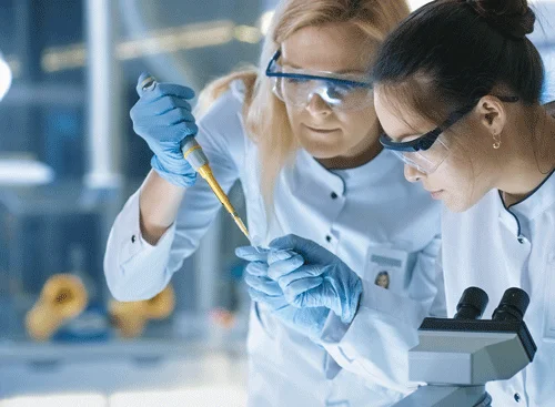 Scientists performing tests in lab.